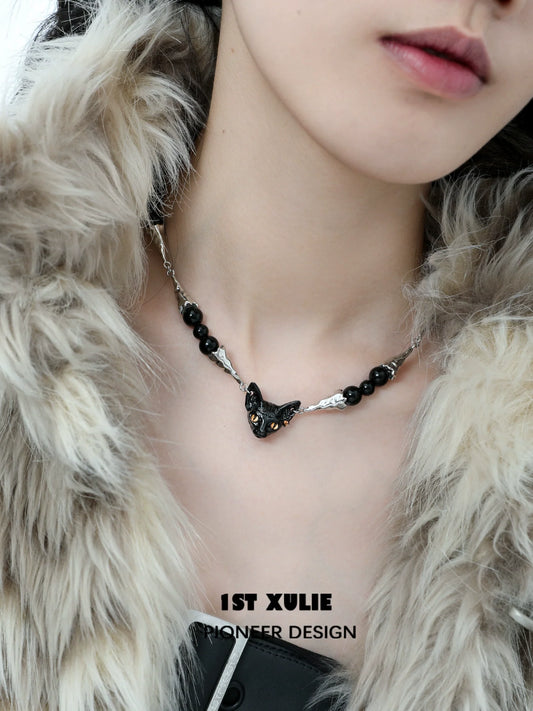 Stylish black cat necklace featuring a sleek design with black beads and a cat-shaped pendant