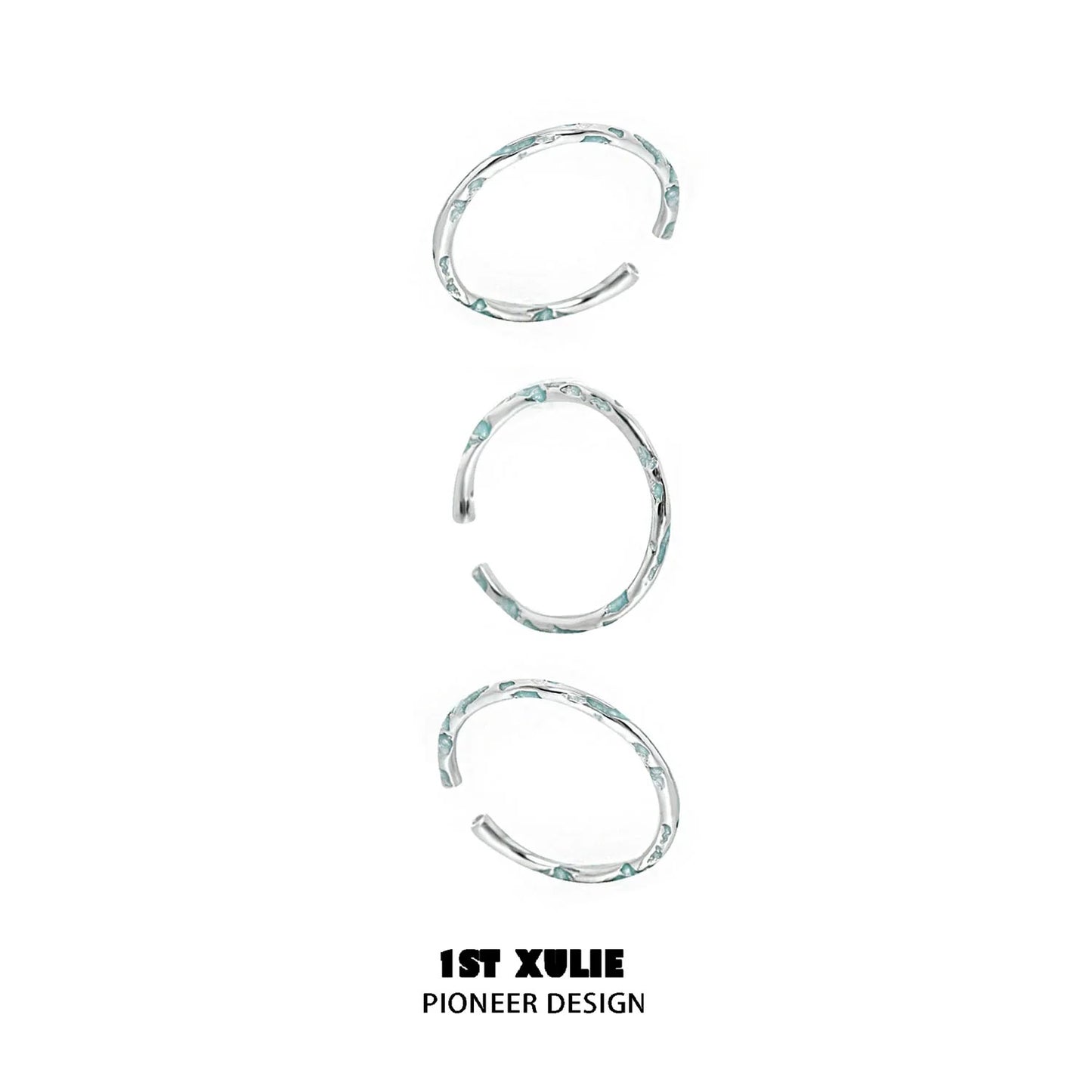 Set of three unique rings featuring a blue textured silver ring design for stylish layering