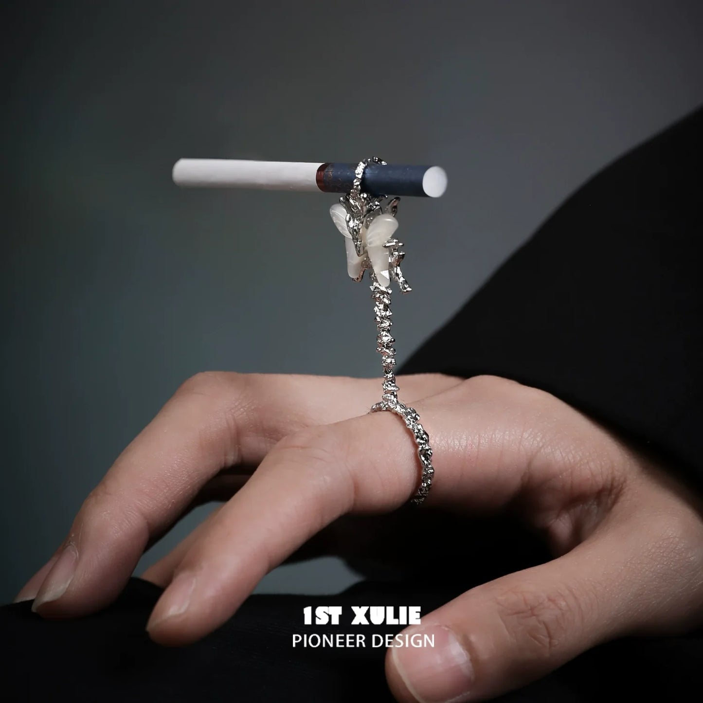 Butterfly cigarette holder ring designed by 1ST XULIE, elegantly showcasing a stylish smoking accessory