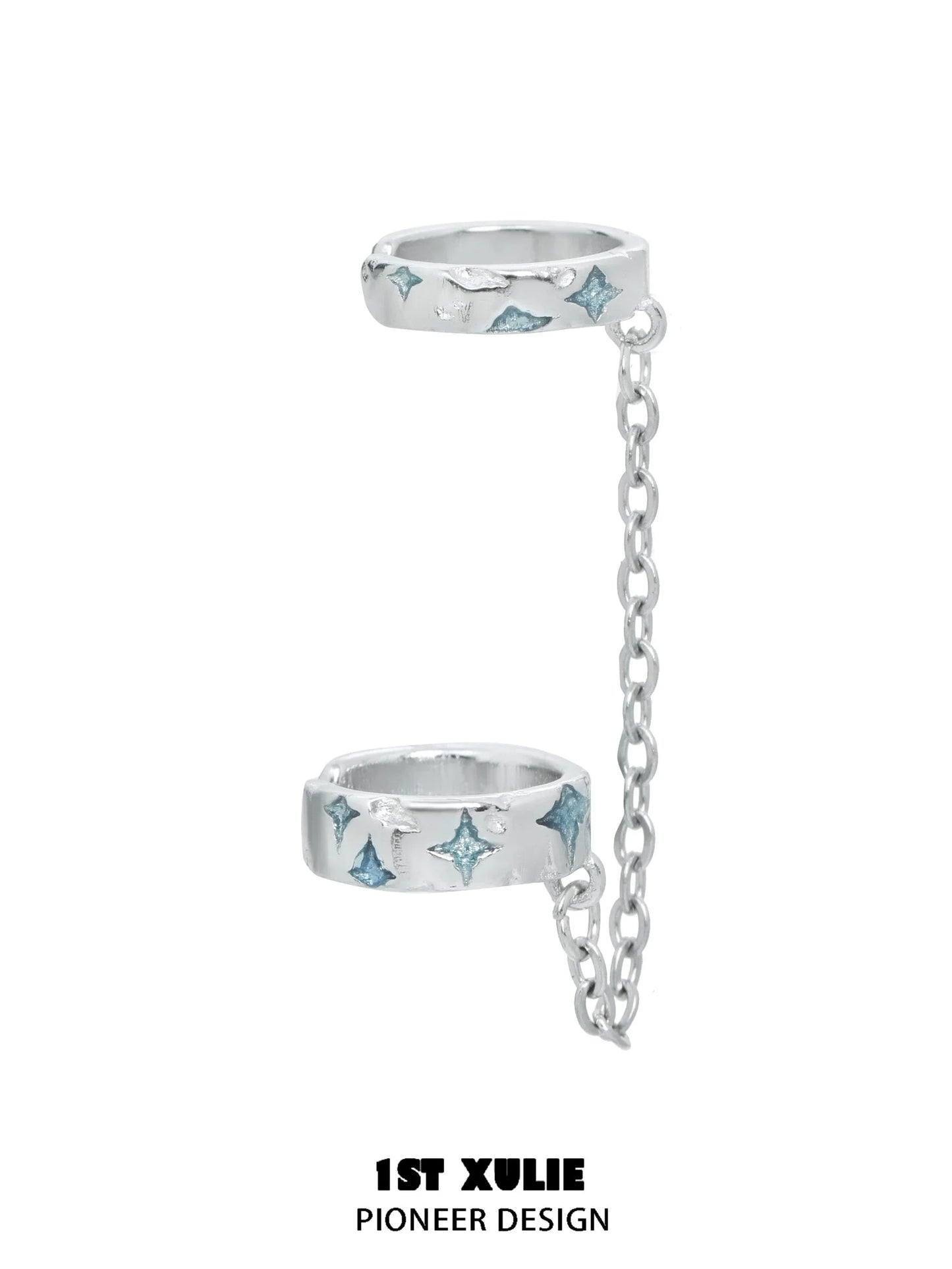 Silver celestial ear cuff featuring blue gemstones and a connecting chain for a trendy look