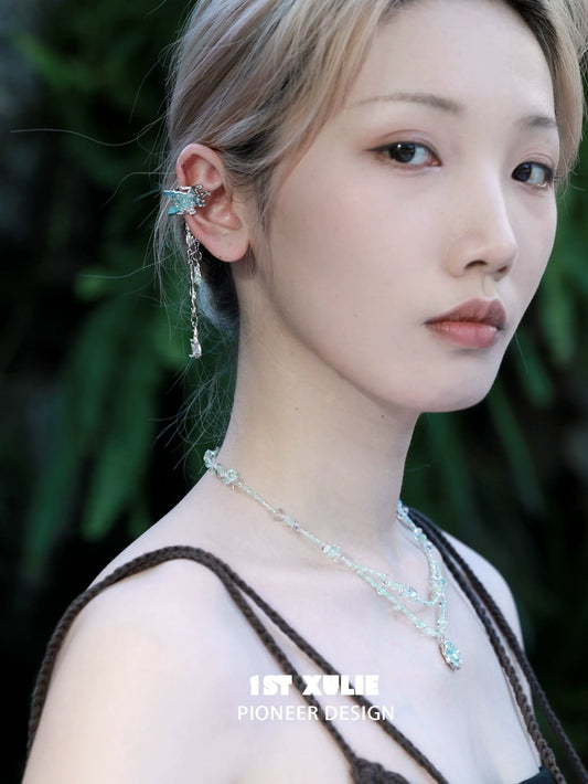 Model wearing crystal tassel ear clips showcasing elegant design and intricate details