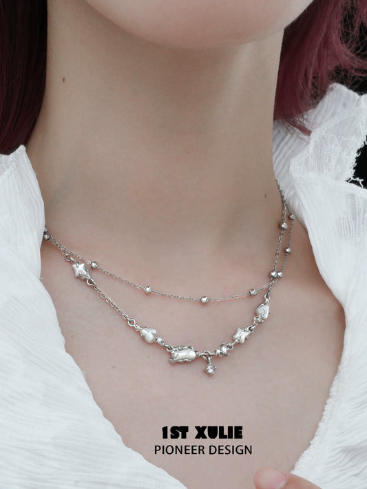 Elegant double layer moon necklace from 1STXULIE featuring shimmering silver charms and delicate chains
