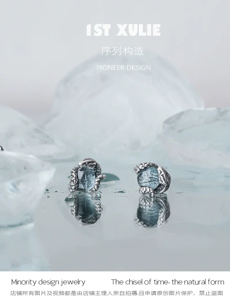 Elegant Slytherin snake earrings with intricate detailing and a silver finish for fans of Harry Potter
