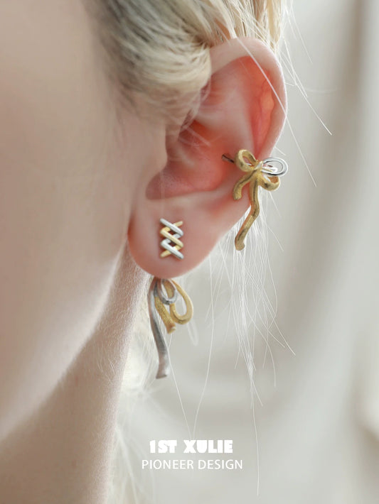 Twisted bow earrings by 1STXULIE with a unique two-tone design for elegant style