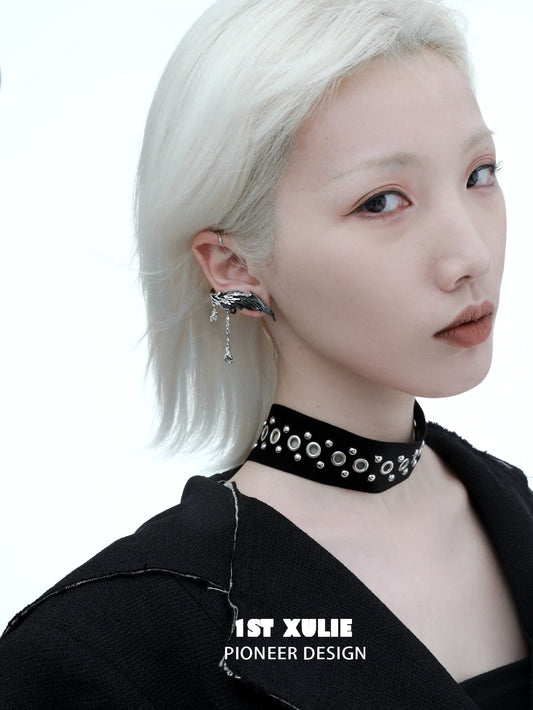 Y2K feather tassel earrings showcased on a model with a modern hairstyle and edgy outfit