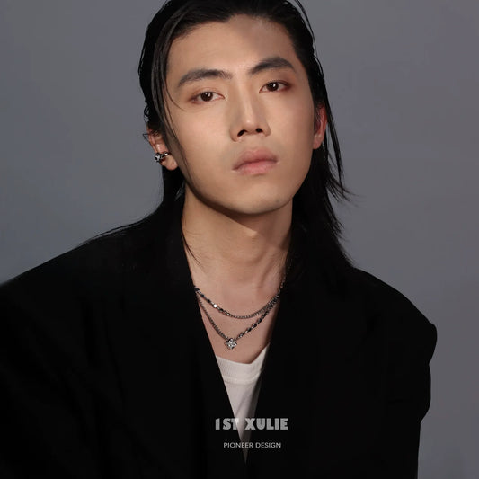 Model wearing a stylish Y2K galaxy necklace layered with silver chains for a trendy look