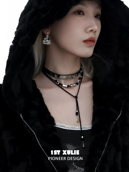 Model wearing a y2k kitty leather necklace with layered styles and distinctive charms