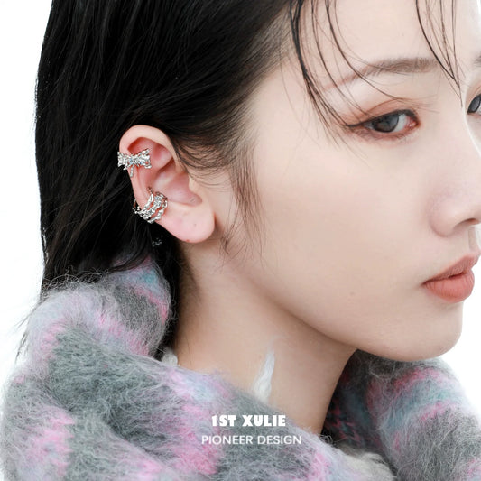 Stylish zircon ear cuffs showcased on a model's ear for trendy jewelry lovers