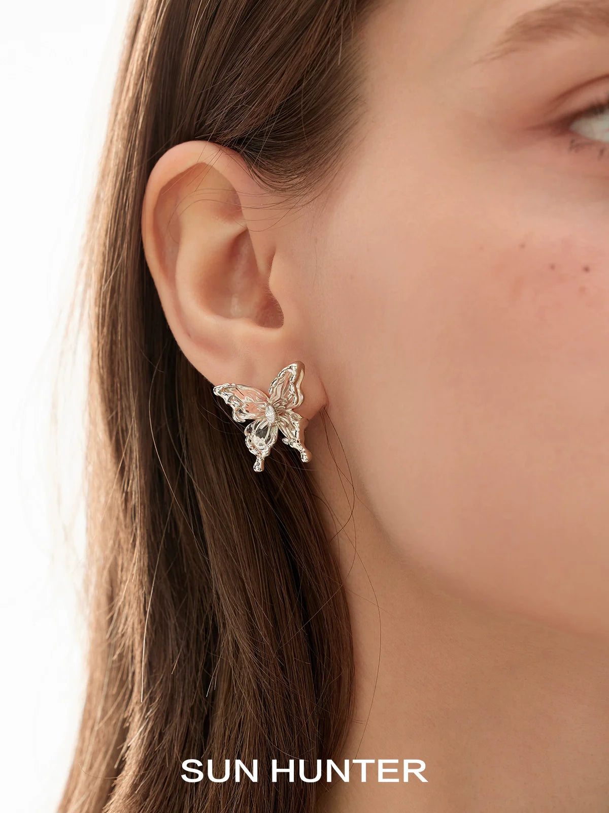 Stylish SUN HUNTER 3D butterfly earrings in silver design for a trendy look