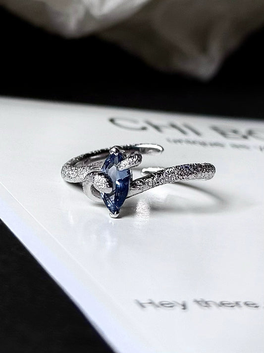 "Snow Snake" Blue Zircon Ring