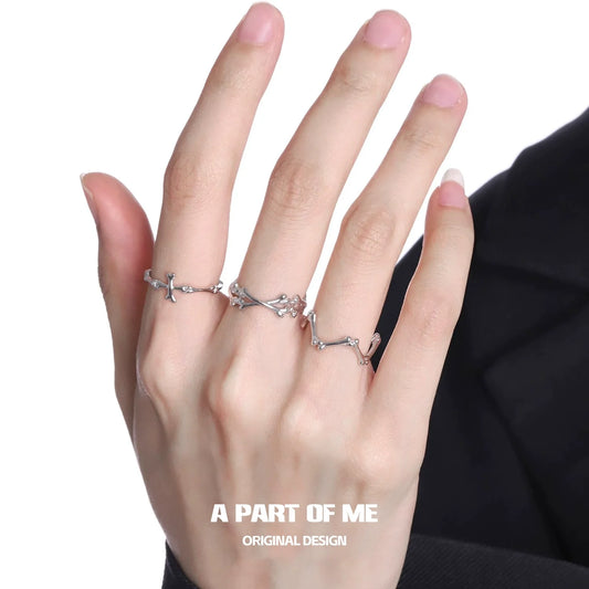 Abstract bone silver ring displayed on a hand, showcasing a unique and artistic design