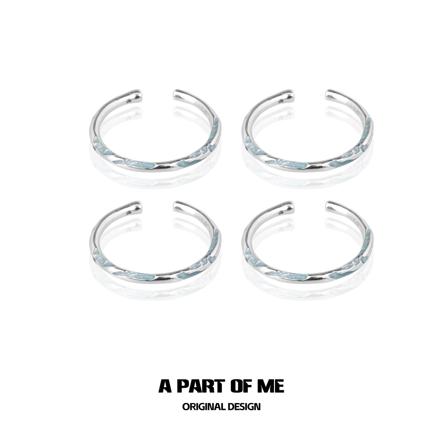 Set of four A PART OF ME blue minimalist rings with sleek silver accents for stylish wear
