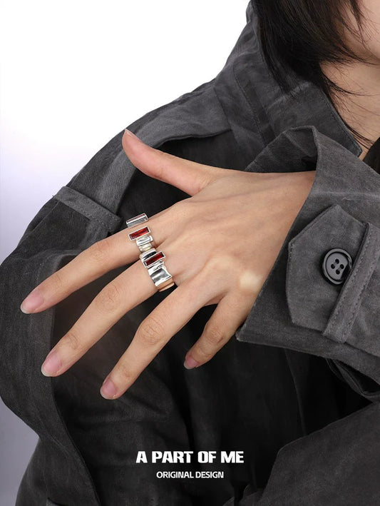 A PART OF ME edgy gothic ring displayed on a hand, featuring a unique stacked design in silver