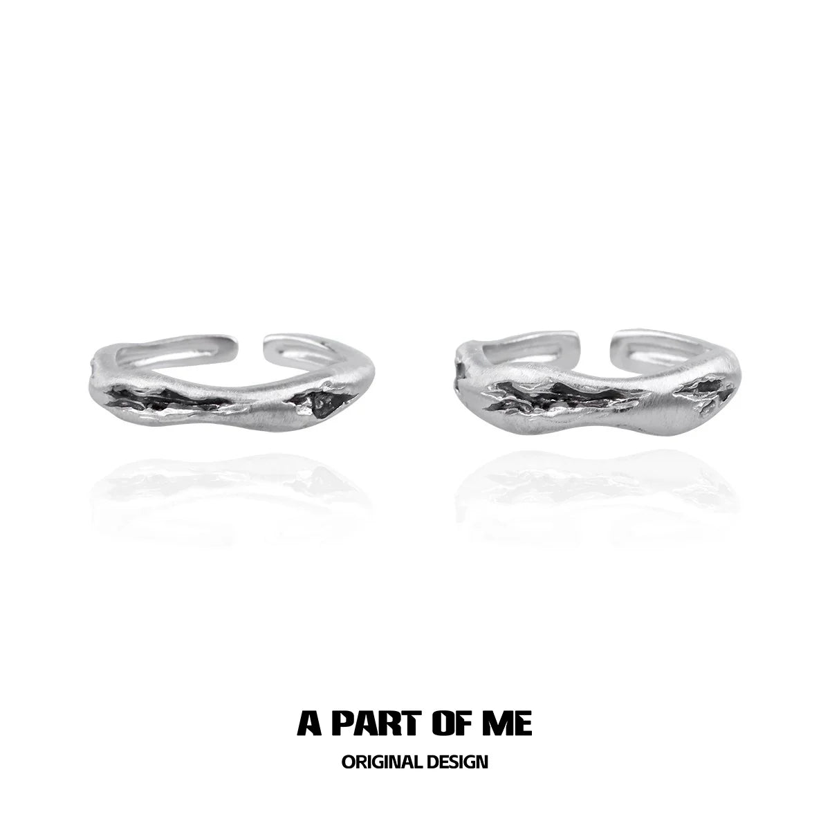 Handcrafted silver geometric couple rings designed by A PART OF ME in an elegant style