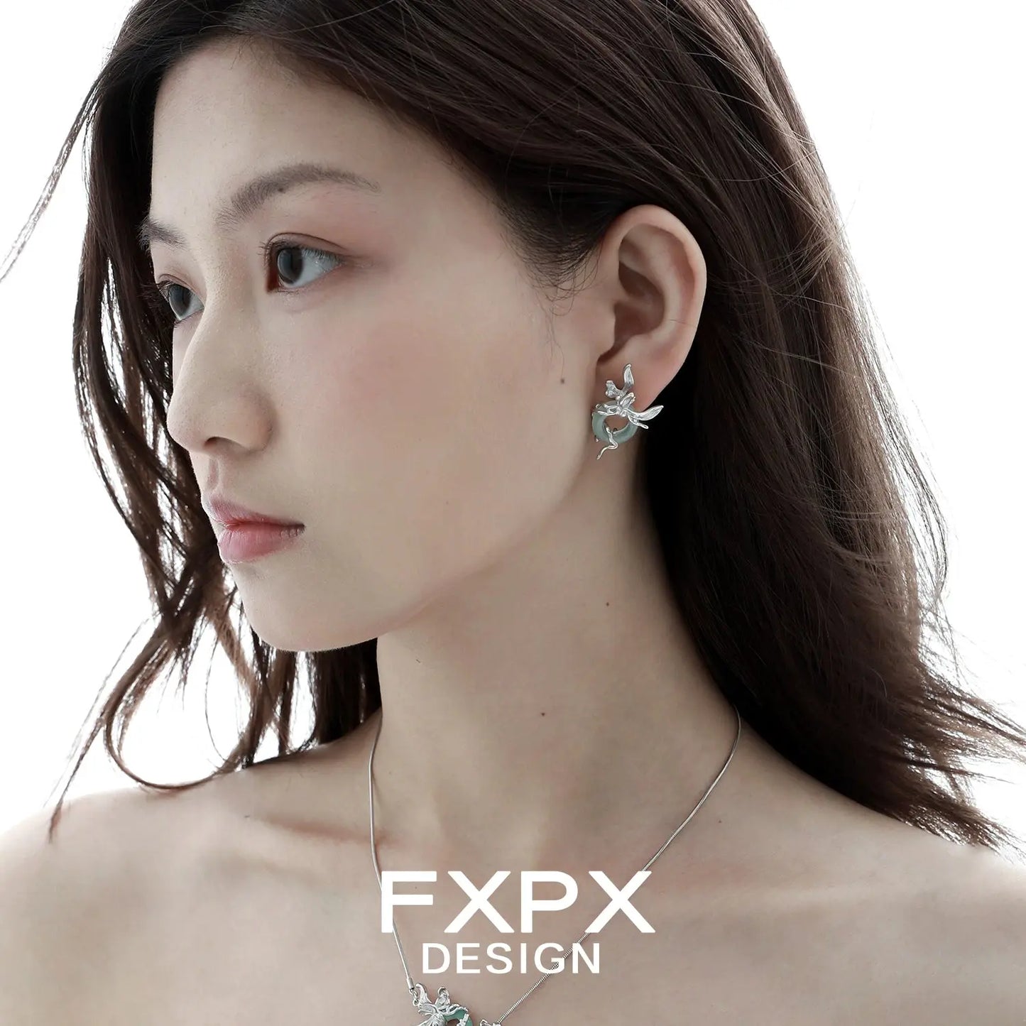 Unique jade earrings for women by FXPX worn by a model showcasing intricate silver floral design