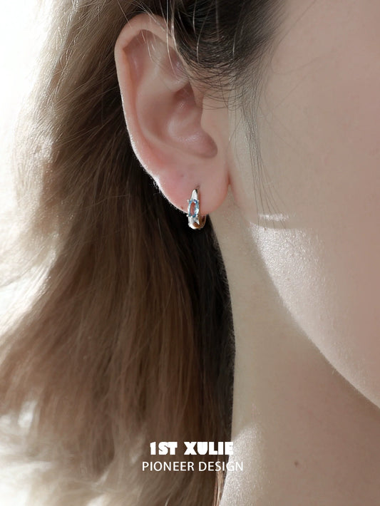 Elegant silver hoop earrings featuring blue cosmic earrings, perfect for any occasion