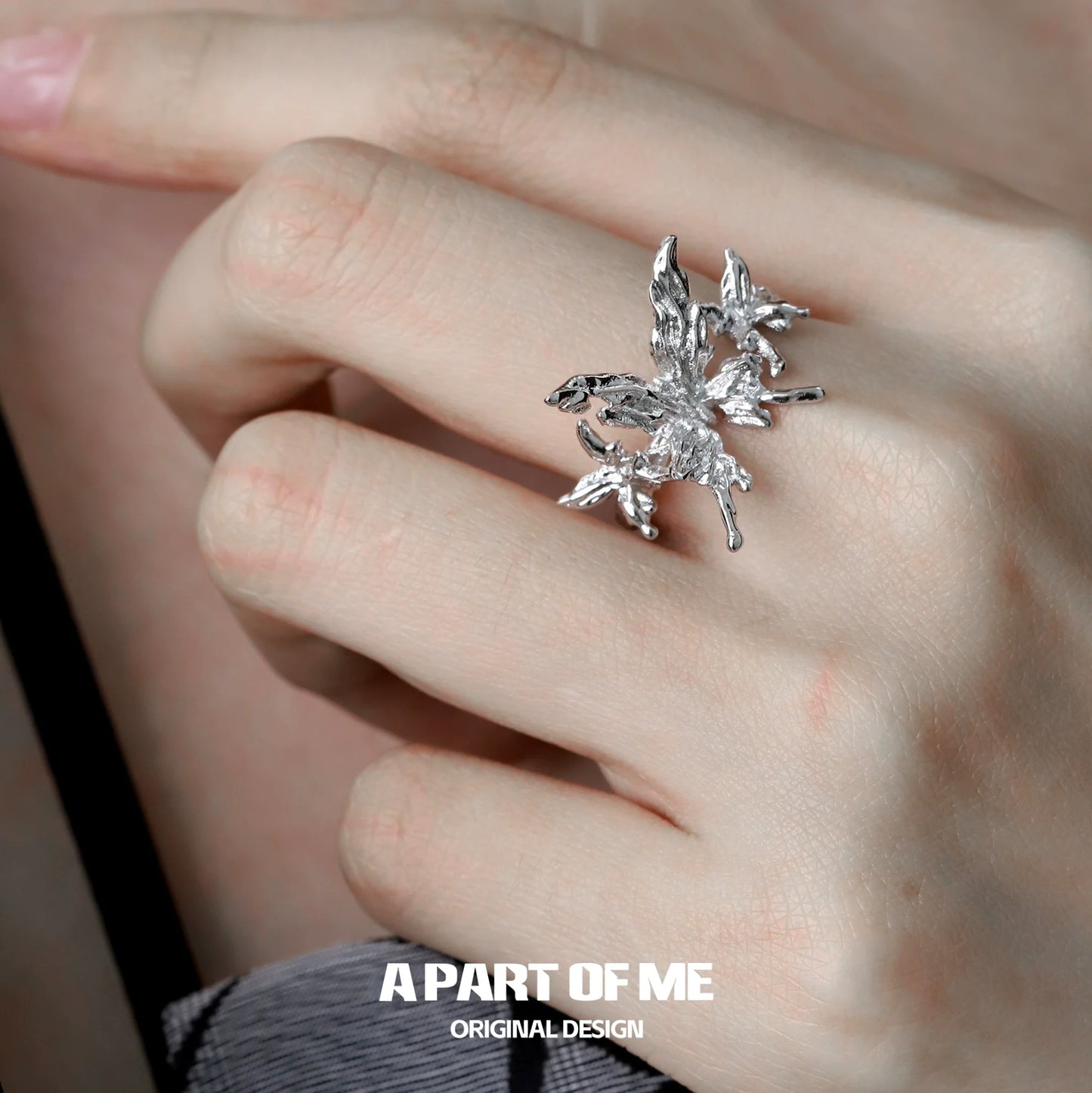 Stylish butterfly punk ring in silver worn on a hand for edgy fashion lovers