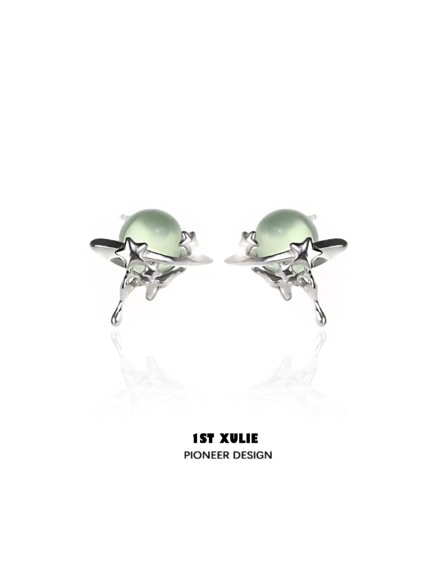 Elegant cosmic meteorite earrings featuring silver stars and green gemstones for a celestial look