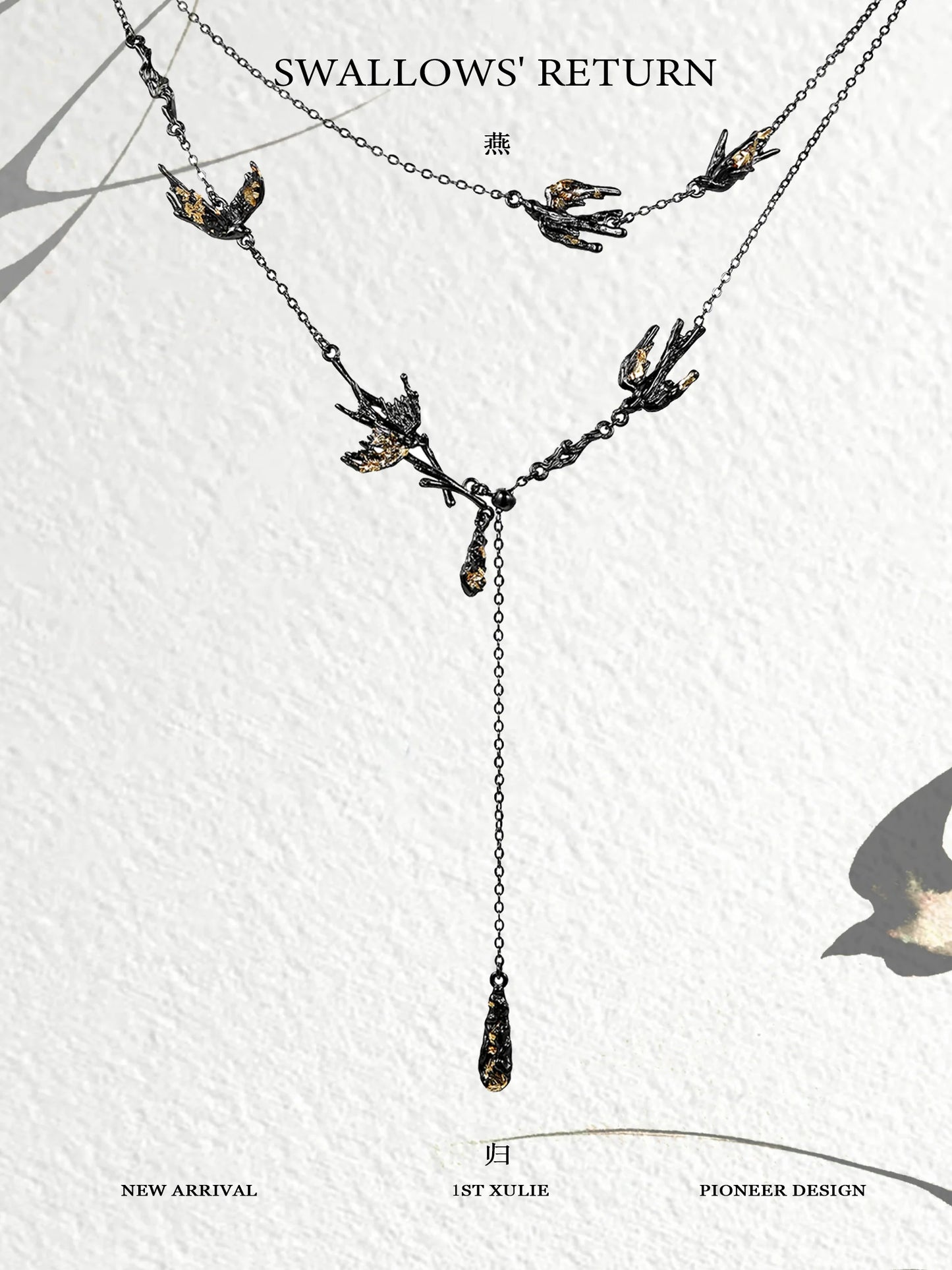 Dark swallow necklace featuring elegant design with multiple swallows and a hanging drop detail
