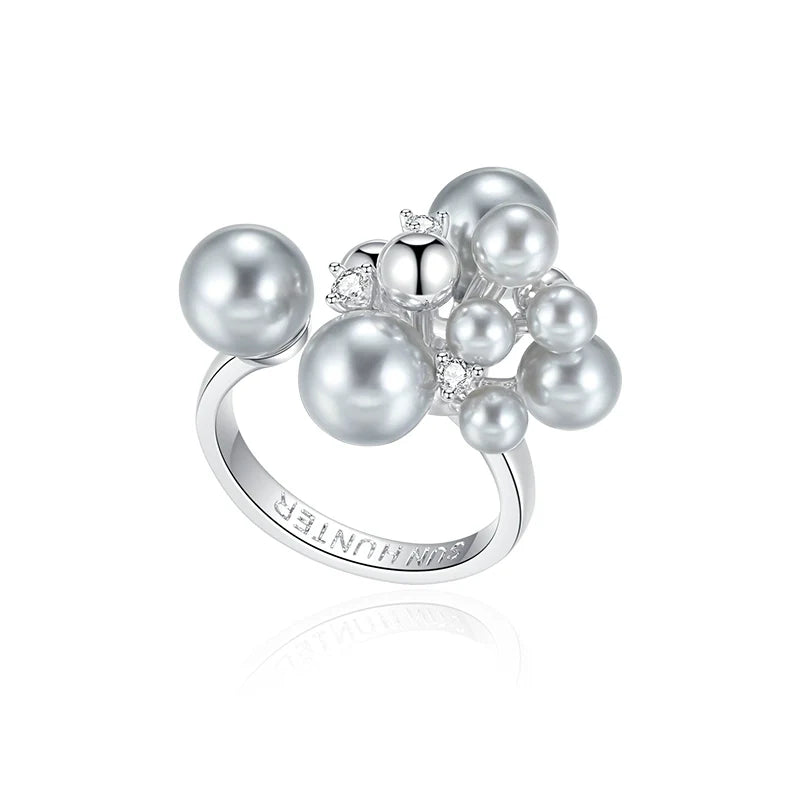 SUN HUNTER elegant pearl statement ring featuring multiple lustrous pearls and sparkling accents
