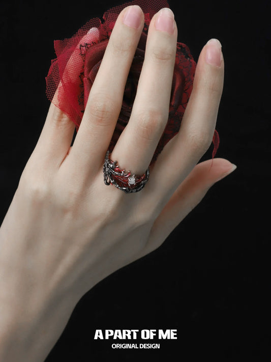 Elegant feather agate ring by A PART OF ME showcased on a hand holding a red rose