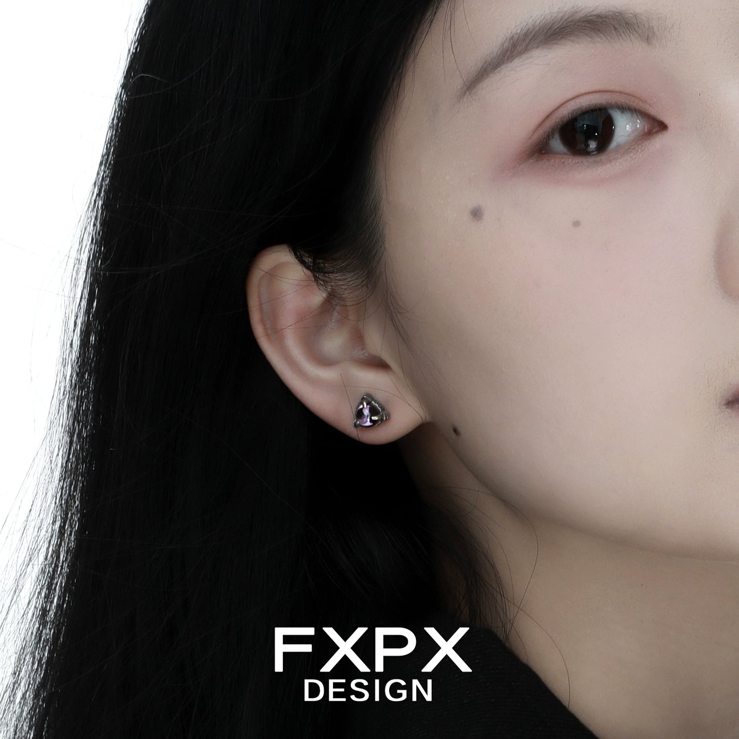 Bloody doll jewelry amethyst dragon earrings worn on ear by model, elegant purple gemstone studs