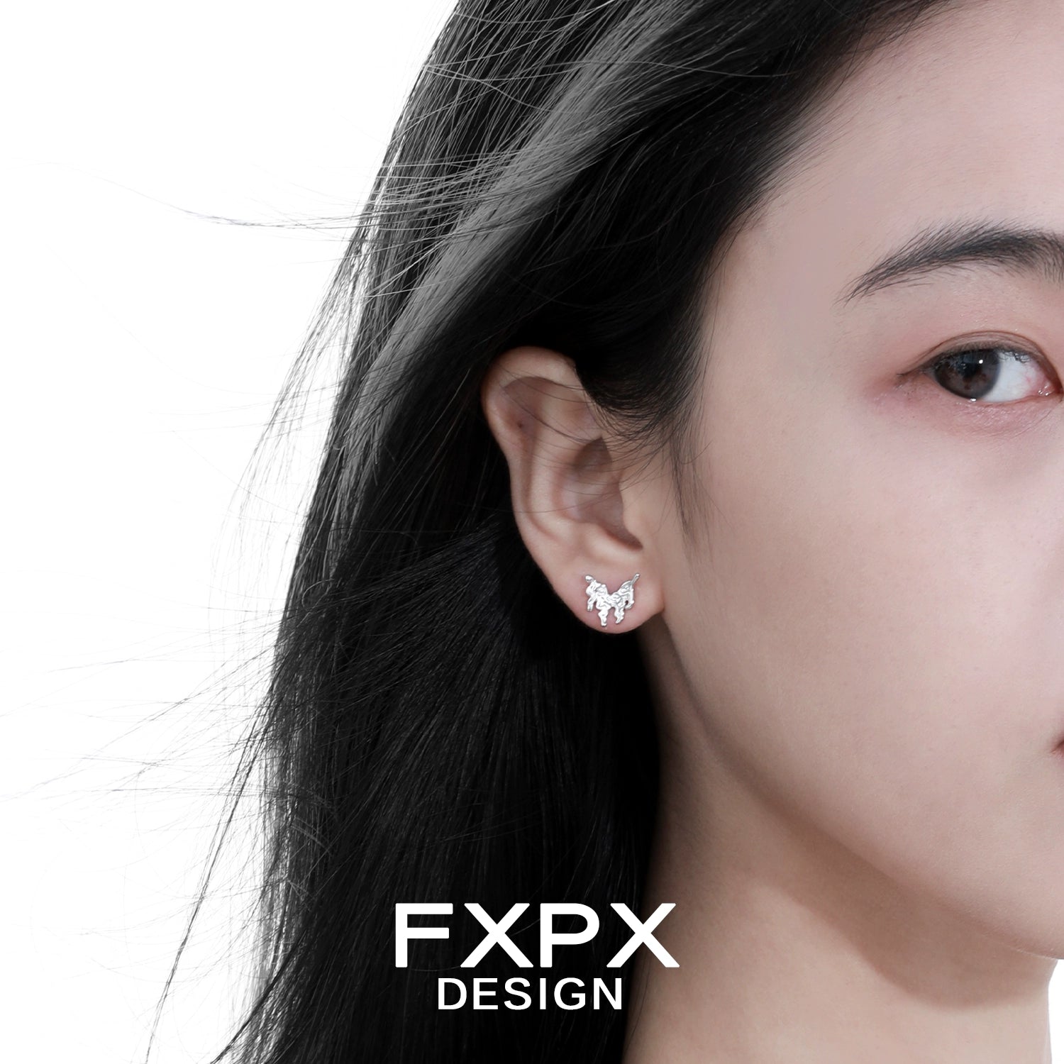 Close-up of woman wearing Bloody Doll Jewelry cyber butterfly earrings in silver from FXPX Design