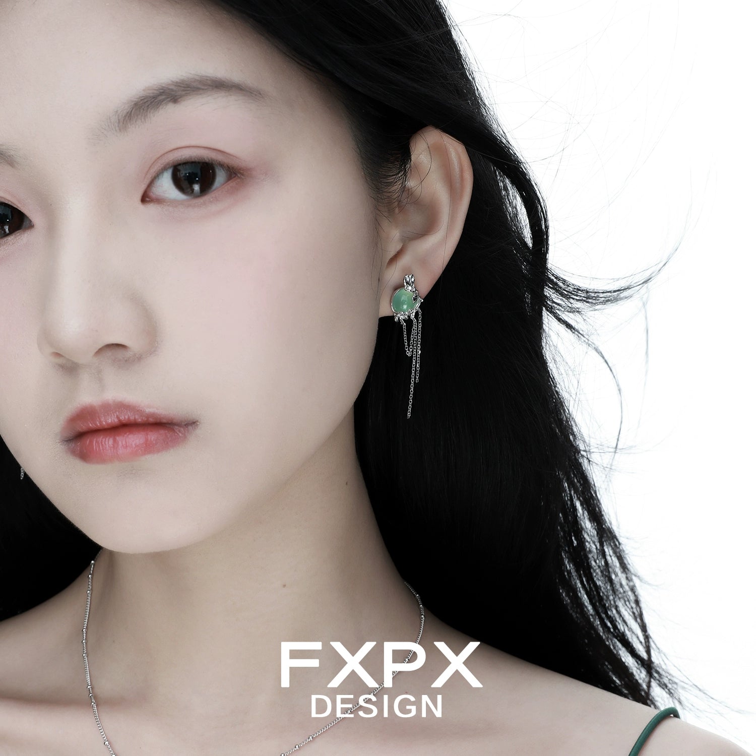 Close-up of Bloody Doll Jewelry gentle green agate tassel earrings worn by model with delicate silver chains