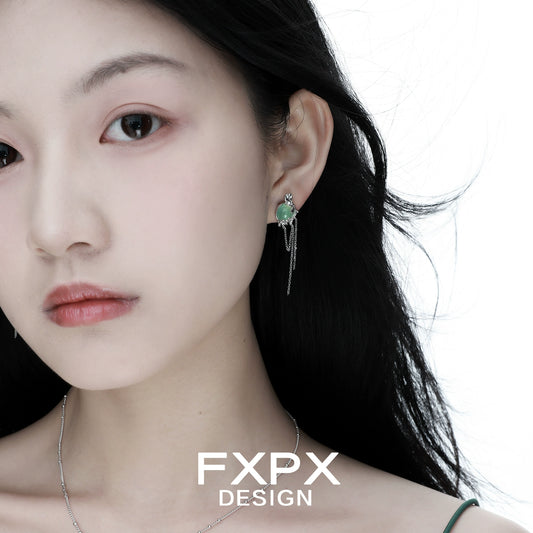 Close-up of Bloody Doll Jewelry gentle green agate tassel earrings worn by model with delicate silver chains