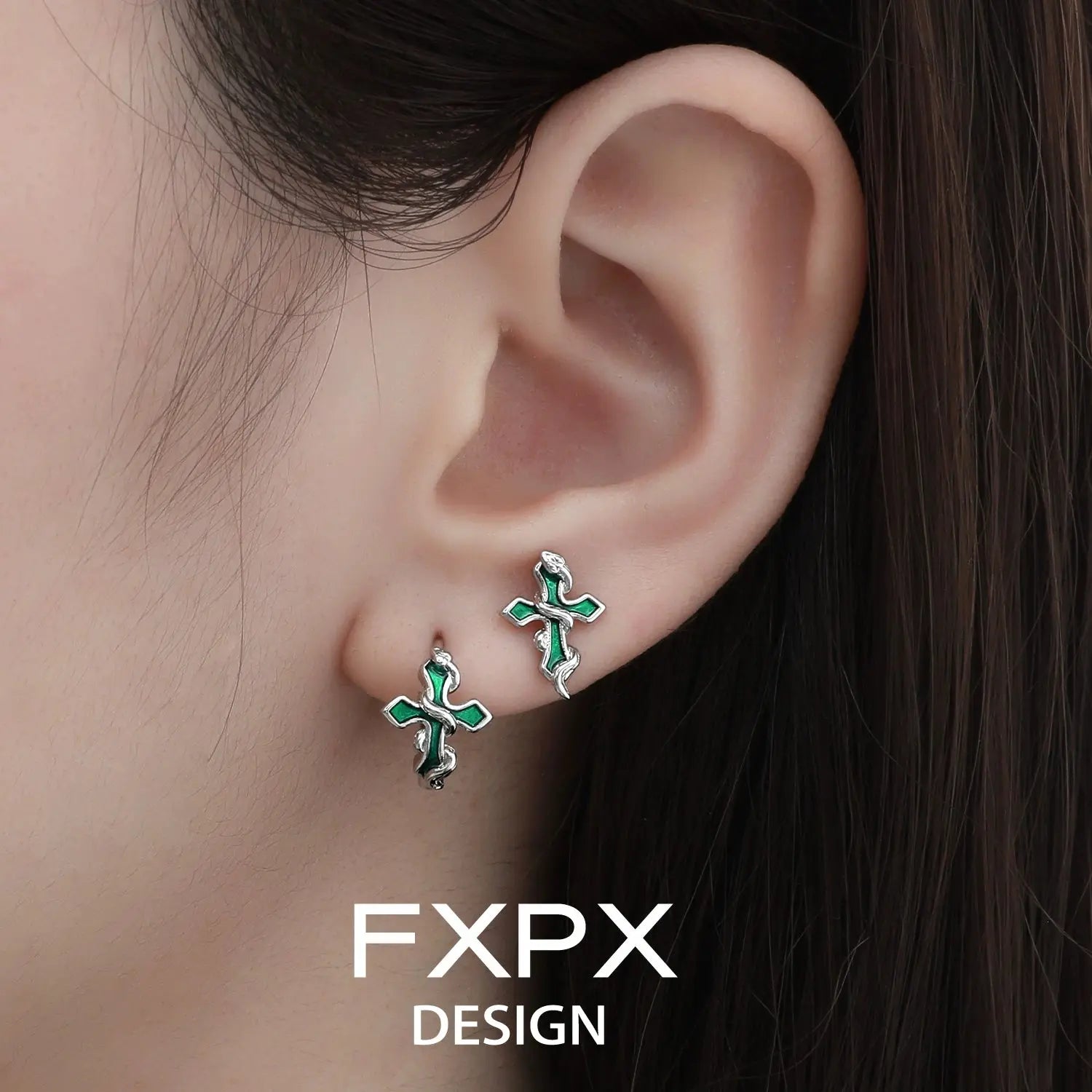 Bloody doll jewelry gothic cross snake earrings in green and silver worn on ear by FXPX