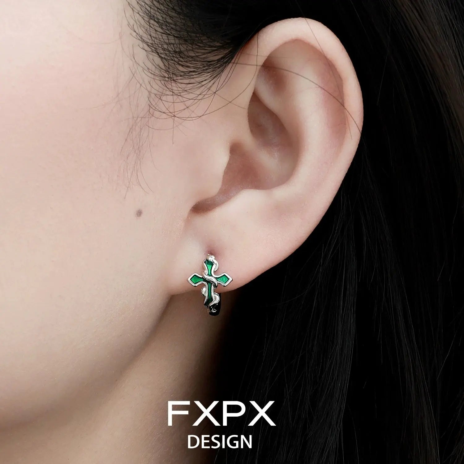 FXPX bloody doll jewelry gothic cross snake earrings worn on ear with black and green design