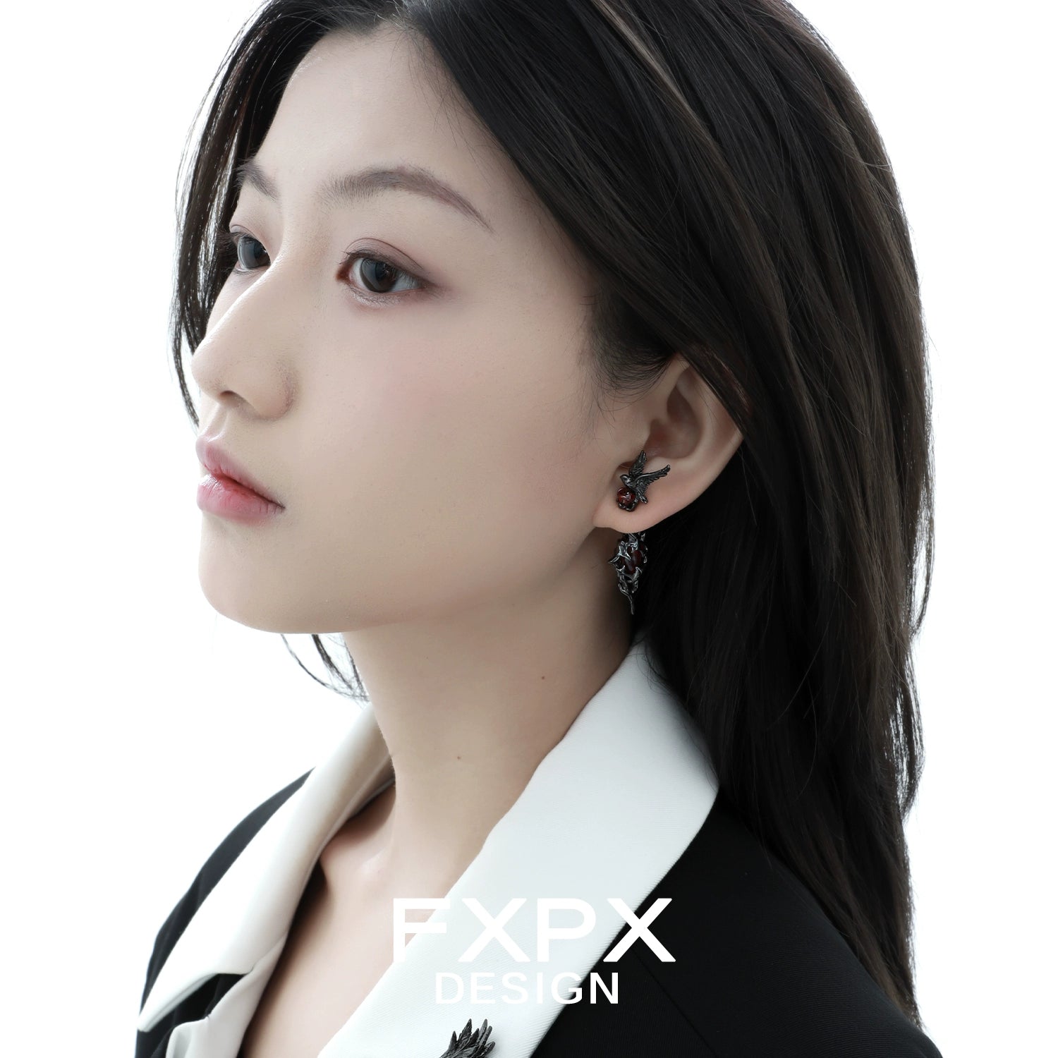 Woman wearing Bloody Doll Jewelry gothic raven earrings showing black raven design