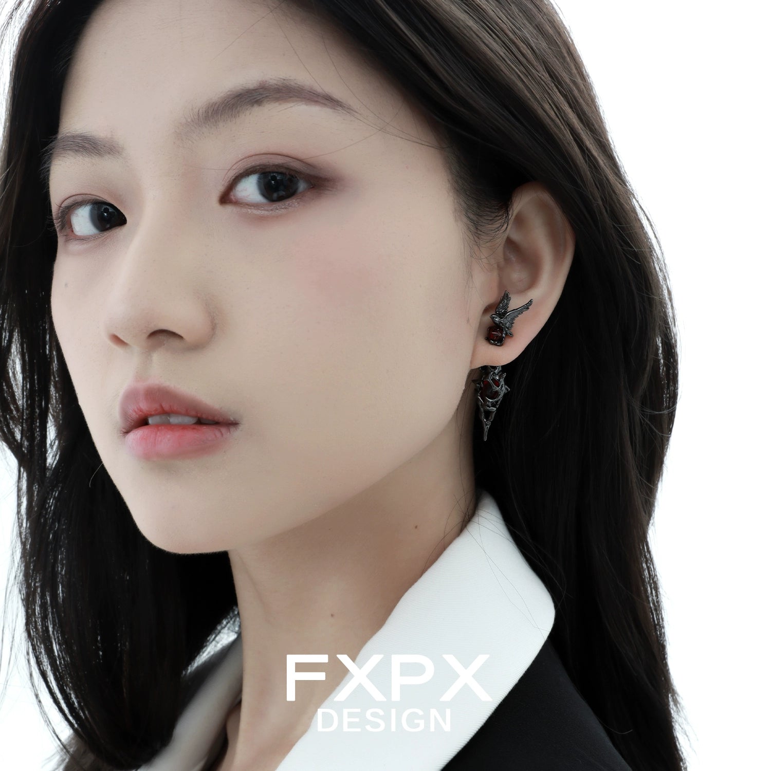 Bloody Doll Jewelry gothic raven earrings worn by a woman with black hair and white collar