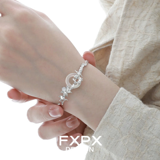 FXPX butterfly sigil bracelet featuring delicate design with sparkling accents on a wrist