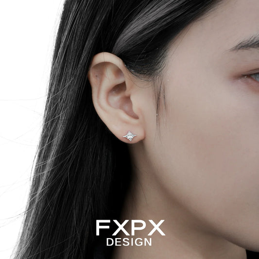 Geometric star cross stud earrings by FXPX showcased on a model's ear for elegant style