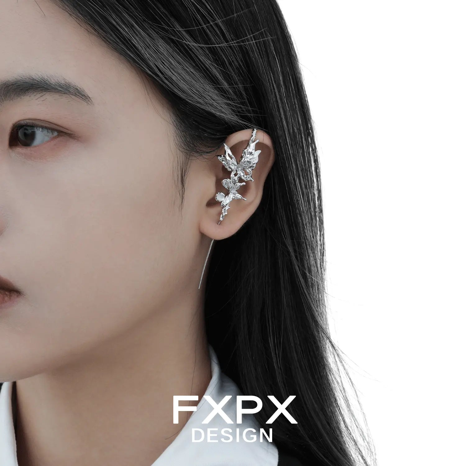 Gothhalo jewelry butterfly agate earring worn on ear with detailed silver leaf design by FXPX