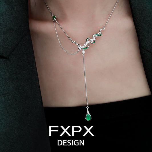 FXPX gothic snake necklace with silver design and green gemstones for a striking look