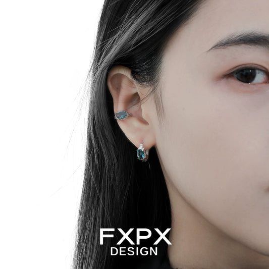 FXPX Iceland blue zircon stud earrings showcased on a model's ear for elegant style