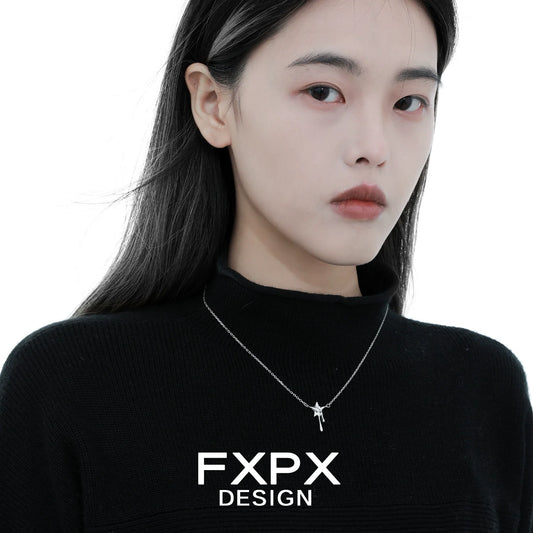 Woman wearing an FXPX moon star silver necklace, showcasing elegant design and charm