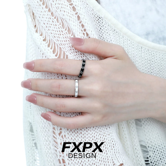 Stylish FXPX mystery couple rings on a hand with a black and white design for matching pairs