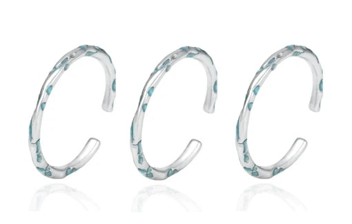 FXPX Ocean Breeze Ring in Silver with Elegant Wave Design and Aqua Accents