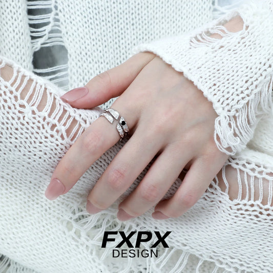Stylish FXPX secret bond couple rings showcased on a hand wearing a cozy white sweater