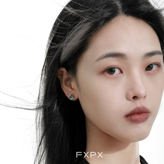 Stylish FXPX serpent ear cuffs worn by a model, showcasing a unique design for trendy accessorizing