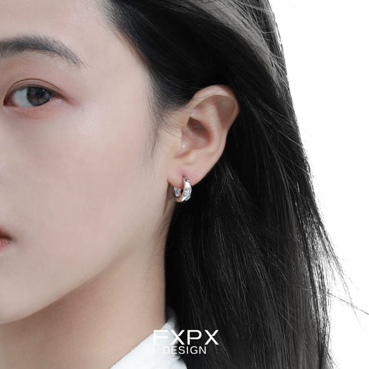 Elegant silver ear clips for women with a modern design, perfect for everyday wear
