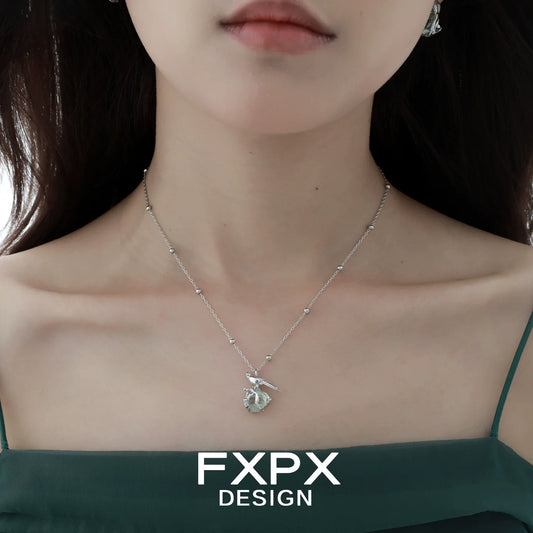 Swallow fluorite silver necklace showcased elegantly on a model's neckline