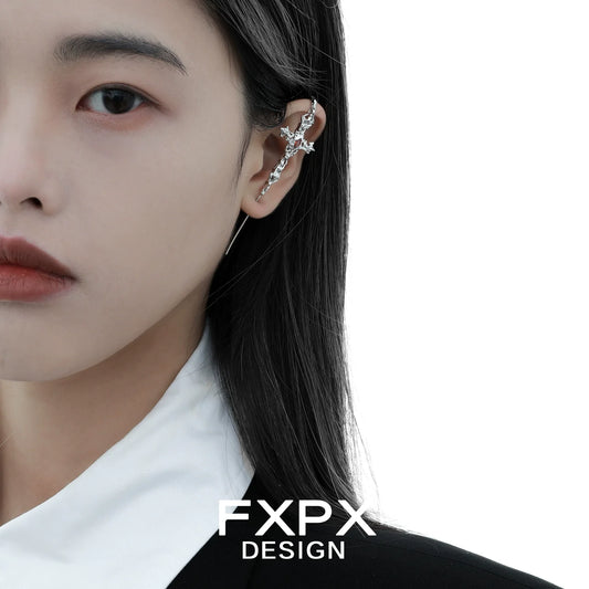 Trendy FXPX Y2K gothic cross earring displayed on a model with black hair and a stylish outfit