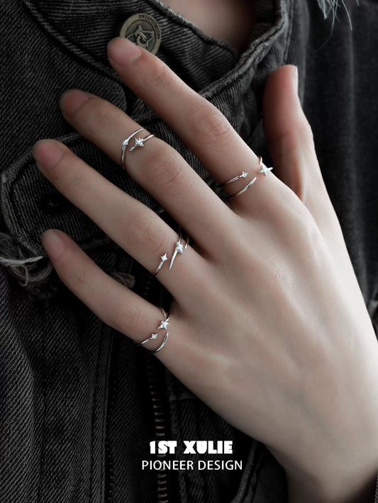 Stylish geometric silver ring set displayed on a hand with three minimalist designs for modern jewelry lovers