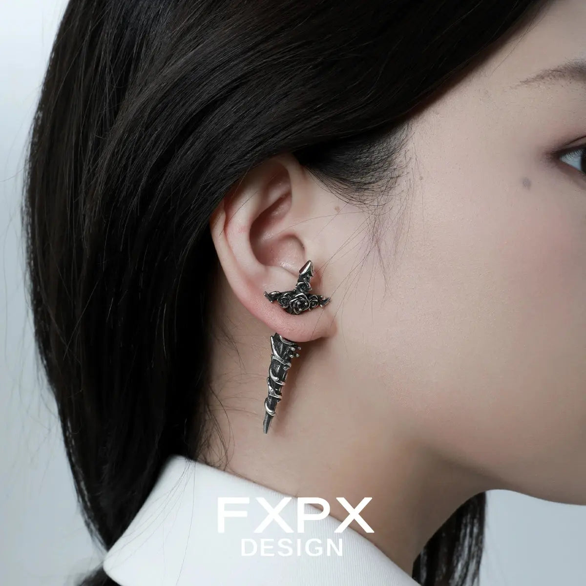 Gothhalo FXPX gothic rose red zircon earrings worn on ear with intricate dark rose design