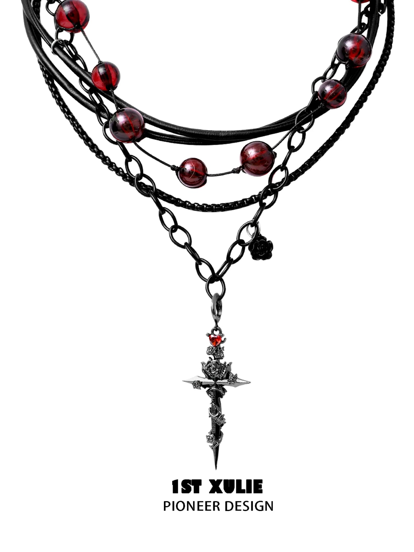 Gothic cross necklace by 1ST XULIE featuring layered chains and red beads for a bold, stylish look