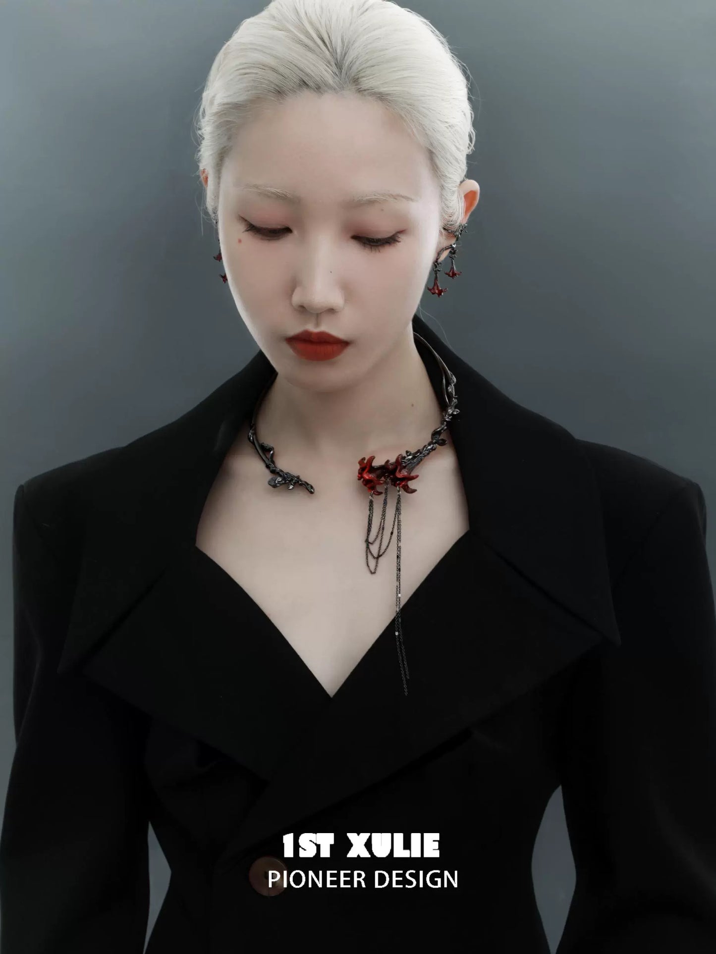 Elegant gothic mandala necklace with intricate designs worn by a model in a stylish black outfit